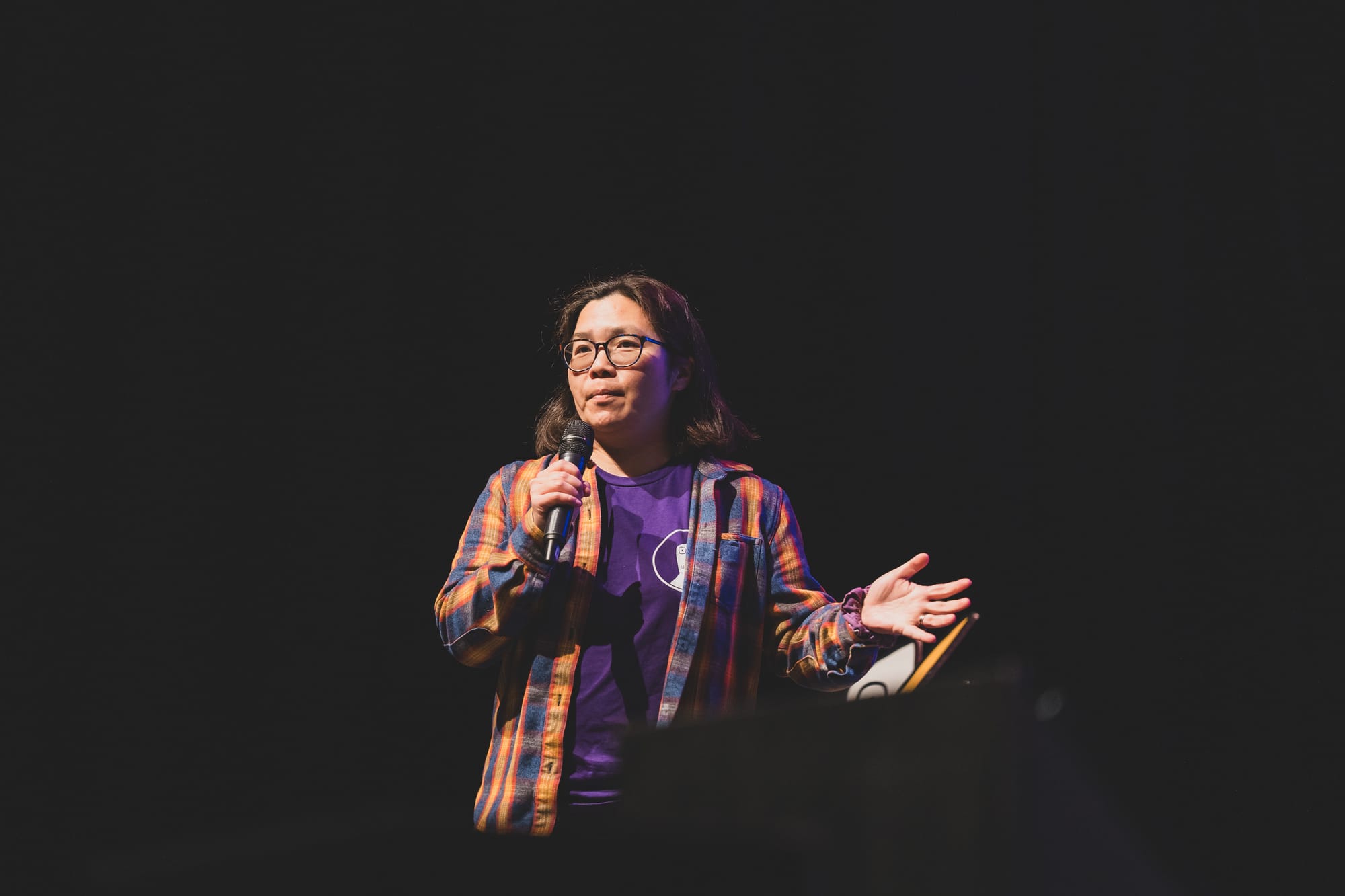 Photo of Michelle Chin speaking at a conference